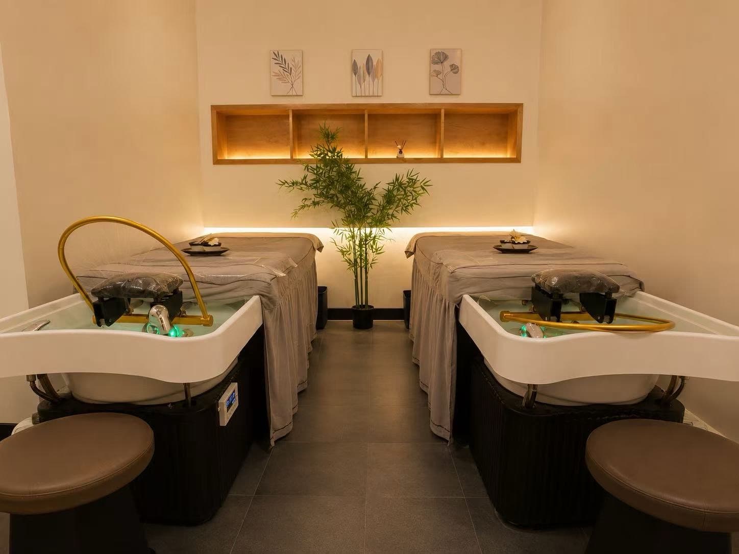 Head spa treatment room with warm lighting and gold basins at Rio Grande Spa NYC