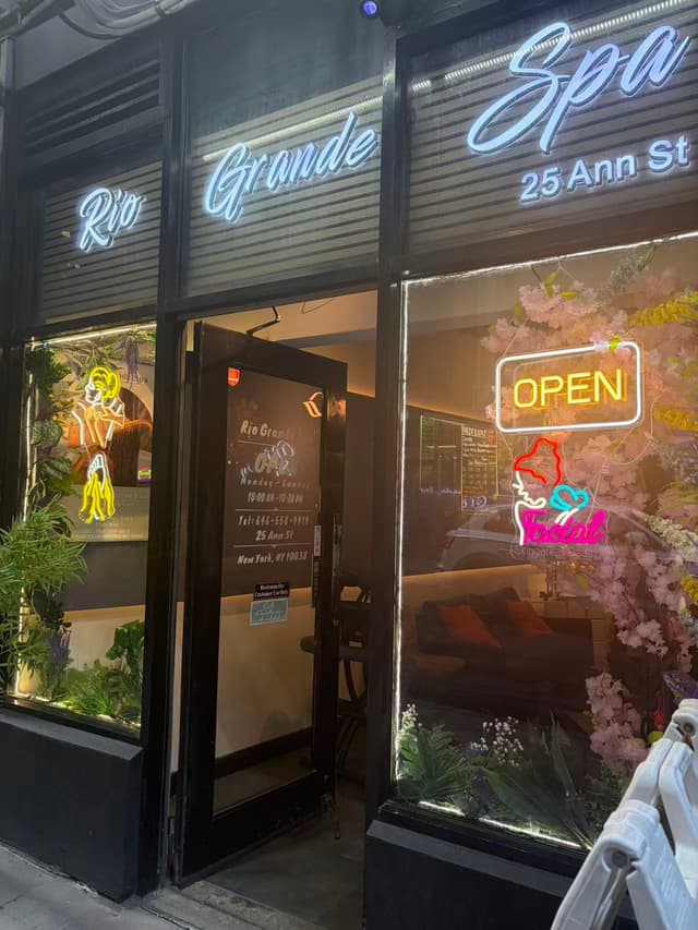 Rio Grande Spa storefront at 25 Ann St with neon signage, open sign and cherry blossom window display